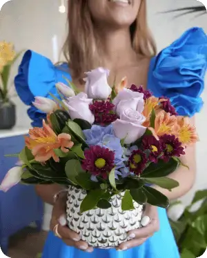 Girl with a floral arrangement for Mother's Day Campaign